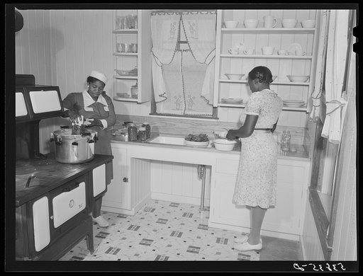 Violet Davenport and Almary Kelly canning squash during a canning demonstration give by home economist Rachel D. Moore at La Delta Project. Thomastown, Louisiana