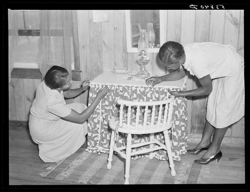 One of the home economists assisting a project family in making their own furniture for their home on La Delta Project. Thomastown, Louisiana