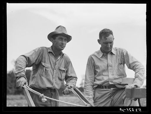 Untitled photo, possibly related to: Parish FSA (Farm Security Administration) supervisor Willis R. Roberts talking and discussing farm problems with brother-in-law of Pleas W. Rodden, rural rehabilitation borrower, who had been cultivating his cotton. West Carroll Parish, Louisiana