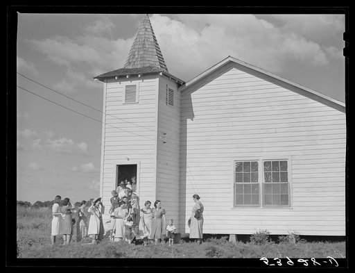Untitled photo, possibly related to: The women's club leaving the church and community building after a home management demonstration by the supervisor and a baby shower they gave for Mrs. Verden Lee, one of their members. Transylvania Project, Louisiana