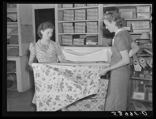 Buying linoleum for her home in project cooperative store. Transylvania Project, Louisiana