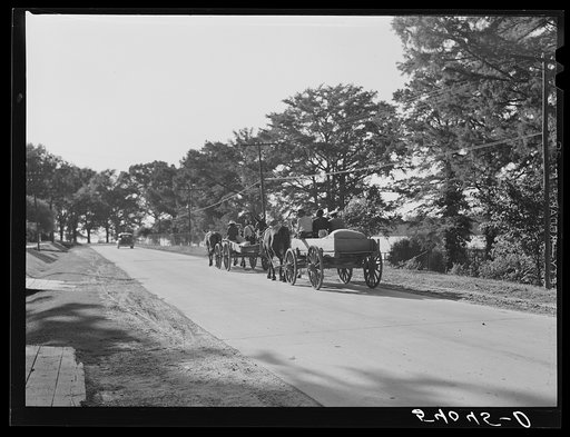 Untitled photo, possibly related to: Returning home with wagons loaded with entire family and supplies on Saturday evening. Lake Providence, Louisiana