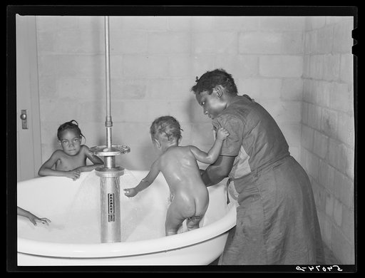 Showers for both babies and older children and parents and complete laundry facilities are provided in the utility building for members of the Okeechobee migratory labor camp. Belle Glade, Florida