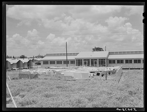 Showers for both babies and older children and for parents and complete laundry facilities are provided in the utility building for members of the Osecola migratory labor camp. Belle Glade, Florida