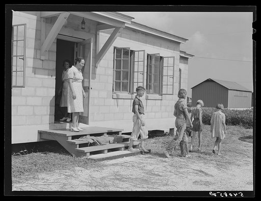 Children leaving health clinic after getting typhoid antitoxin shots at Osceola migratory labor camp. Belle Glade, Florida