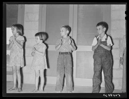 Supervised play hour for younger children in assembly building at Osceola migratory labor camp. Belle Glade, Florida