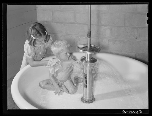 Showers for both babies and older children and for parents and complete laundry facilities are provided in the utility building for members in the utility building for members of the Osceola migratory labor camp. Belle Glade, Florida