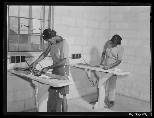 Showers for both babies and older children and for parents and complete laundry facilities are provided in the utility building for members of the Okeechobee migratory labor camp. Belle Glade, Florida