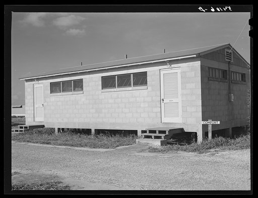 Large comfort stations, toilets and washroom are at each end of the shelter units. Osceola migratory labor camp, Belle Glade, Florida