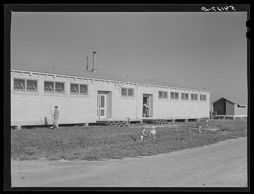 Untitled photo, possibly related to: Large comfort stations, toilets and washroom are at each end of the shelter units. Osceola migratory labor camp, Belle Glade, Florida