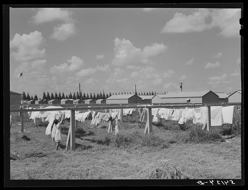Showers for both babies and older children and for parents and complete laundry facilities are provided in the utility building for members of the Okeechobee migratory labor camp. Belle Glade, Florida