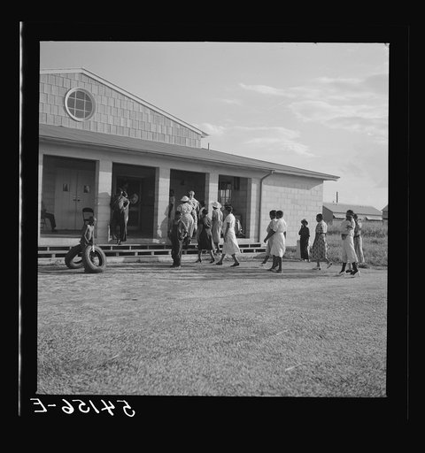 The assembly building is always open for meetings, games, reading, and recreational activities at Okeechobee migratory labor camp. Belle Glade, Florida