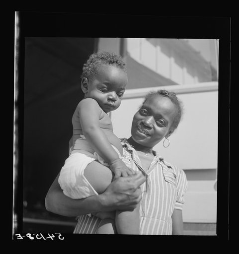 Untitled photo, possibly related to: Mother and child at Okeechobee migratory labor camp, where they have a nurse and clinic for prenatal and postnatal care. Belle Glade, Florida