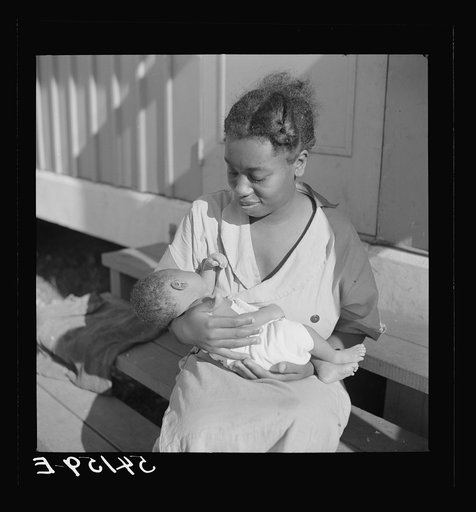Mother of first baby born in Okeechobee migratory labor camp, where they have a nurse and clinic for prenatal care. Belle Glade, Florida