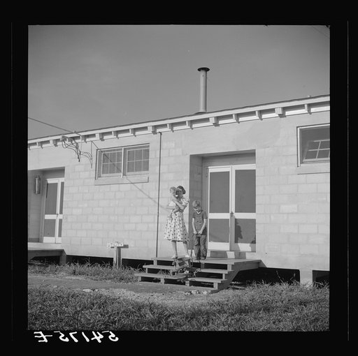 Untitled photo, possibly related to: Children coming into utility building after their showers. It is also equipped with complete laundry facilities. Osceola migratory labor camp,  Belle Glade, Florida