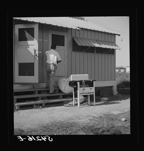 Camp members moving into shelter at Okeechobee migratory labor camp. Belle Glade, Florida