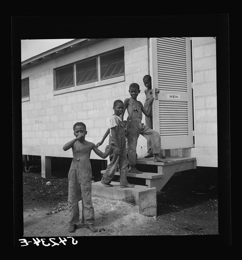 Untitled photo, possibly related to: Large comfort stations, toilets and washroom are provided in center of each end of shelter units. Okeechobee migratory labor camp. Belle Glade, Florida