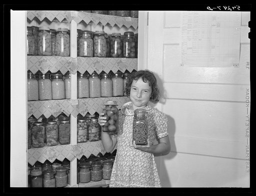 The canned goods closet, and chart (on door) of one of the project families. Terrebonne Project, Schriever, Louisiana