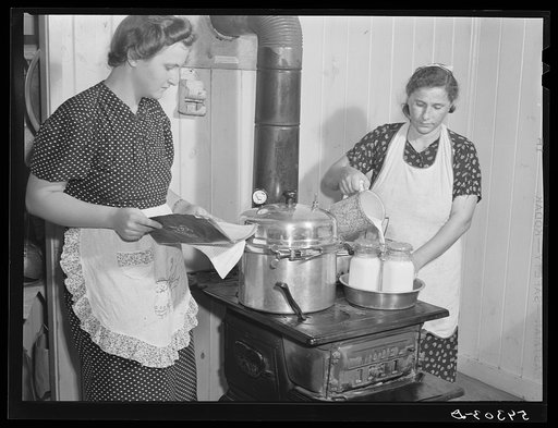Canning milk with pressure cooker in project family's home. Terrebonne Project, Schriever, Louisiana