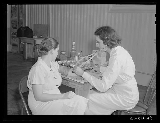 The project nurse takes a member's blood pressure during the prenatal clinic. Terrebonne Project, Schriever, Louisiana