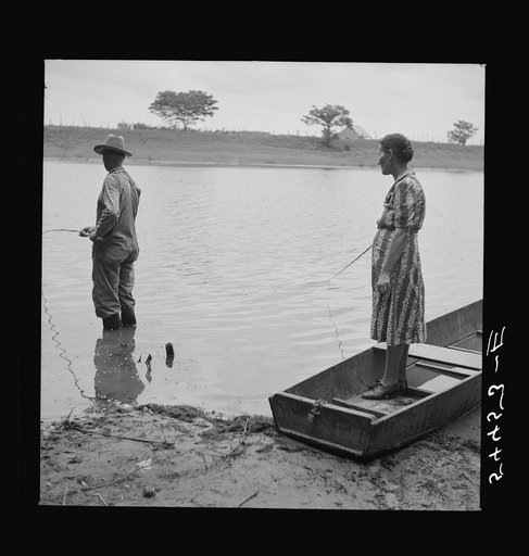 Untitled photo, possibly related to: Farmer and his wife fishing in Cane River on Fourth of July. Later the whole family had a fish fry. Near Natchitoches, Louisiana