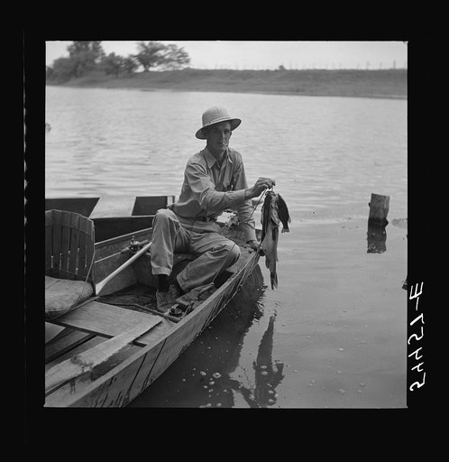 Boating and fishing along Cane River on Fourth of July near Natchitoches, Louisiana