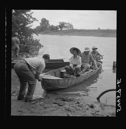 Boating and fishing along Cane River on Fourth of July. Near Natchitoches, Louisiana