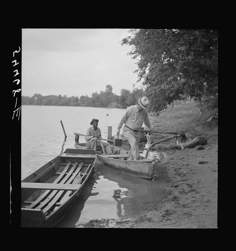 Boating and fishing along Cane River on Fourth of July. Near Natchitoches, Louisiana