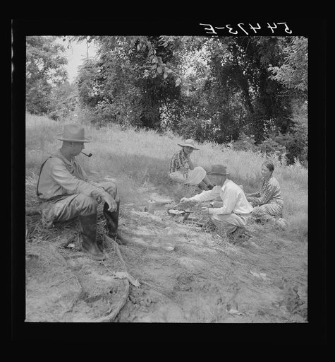 Farm family having fish fry along Cane River on Fourth of July near Natchitoches, Louisiana