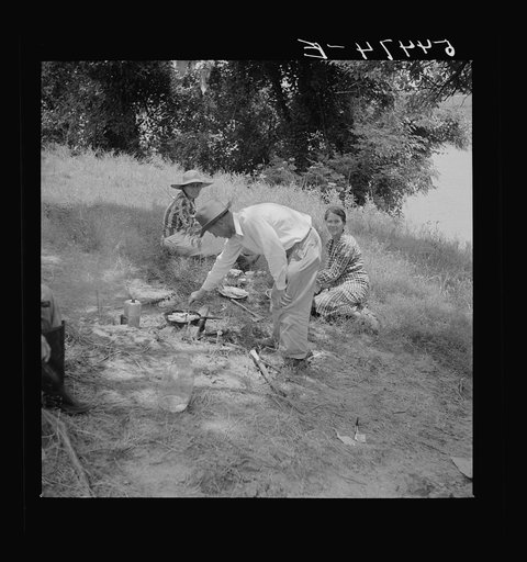 Untitled photo, possibly related to: Farm family having fish fry along Cane River on Fourth of July near Natchitoches, Louisiana