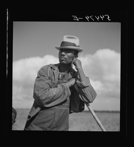 Untitled photo, possibly related to: Member of Allen Plantation cooperative association resting while hoeing cotton. Near Natchitoches, Louisiana
