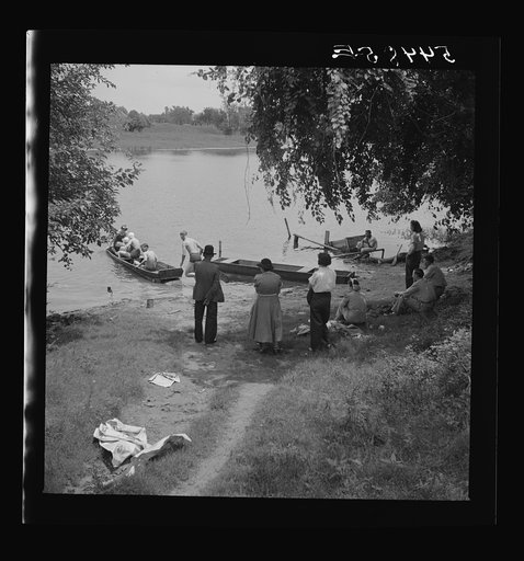 Boating and fishing along Cane River on Fourth of July near Natchitoches, Louisiana
