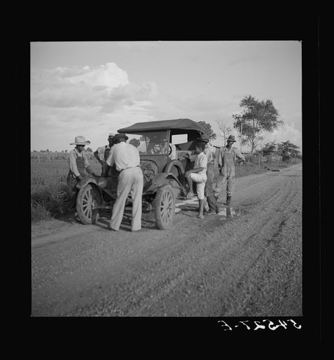 Untitled photo, possibly related to: Melrose, Natchitoches Parish, Louisiana. Trying to repair a "Model T" Ford on Saturday afternoon
