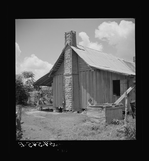 Melrose, Natchitoches Parish, Louisiana. Chimney built of mud and sticks on home of mulatto family, a tenant on Balthazar Plantation (see general caption)
