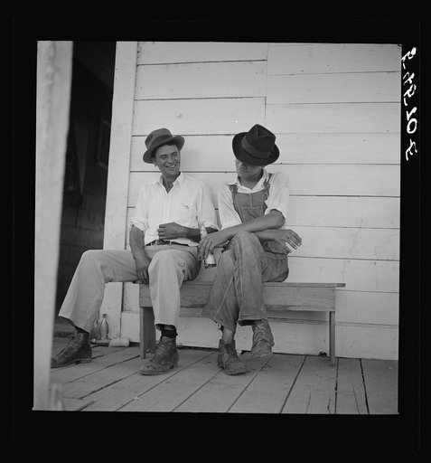 Melrose, Natchitoches Parish, Louisiana. Mulattoes sitting on the porch of country store and bar near John Henry cotton plantation