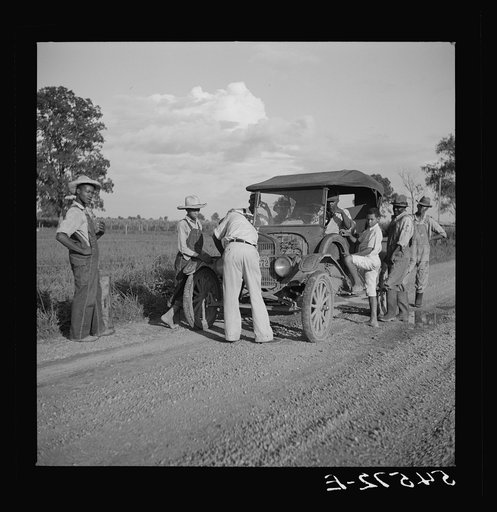Untitled photo, possibly related to: Melrose, Natchitoches Parish, Louisiana. Trying to repair a "Model T" Ford on Saturday afternoon