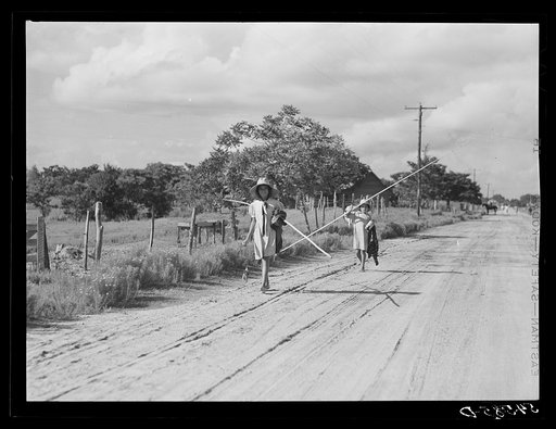 Melrose, Natchitoches Parish, Louisiana. Children of mulatto family returning home after an afternoon's fishing in Cane River