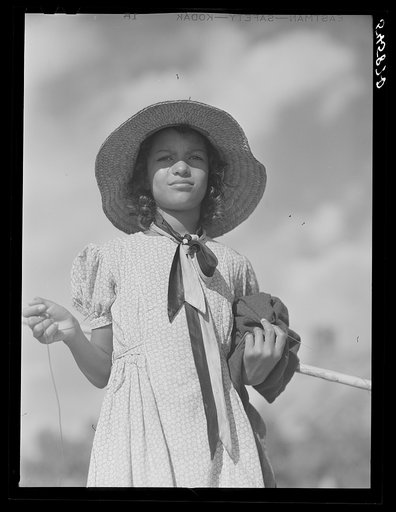 Untitled photo, possibly related to: Melrose, Natchitoches Parish, Louisiana. Daughter of mulatto family returning home after fishing in the Cane River