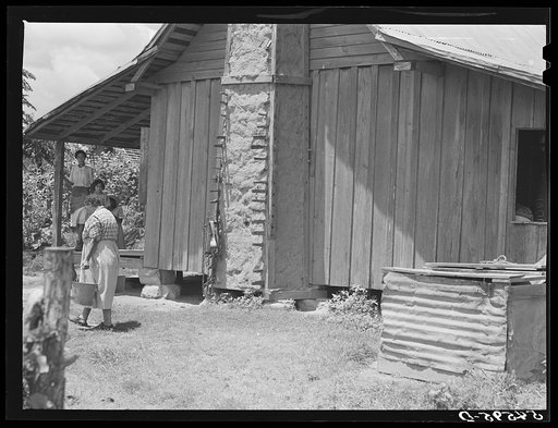 Untitled photo, possibly related to: Melrose, Natchitoches Parish, Louisiana. Chimney built of mud and sticks on home of mulatto family, a tenant on Balthazar Plantation (see general caption)