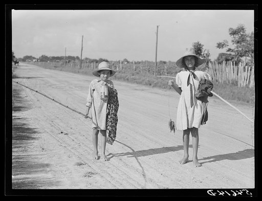 Untitled photo, possibly related to: Melrose, Natchitoches Parish, Louisiana. Children of mulatto family returning home after an afternoon fishing in Cane River