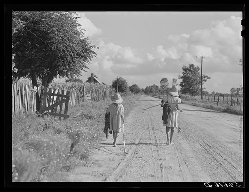 Untitled photo, possibly related to: Melrose, Natchitoches Parish, Louisiana. Children of mulatto family returning home after an afternoon fishing in Cane River