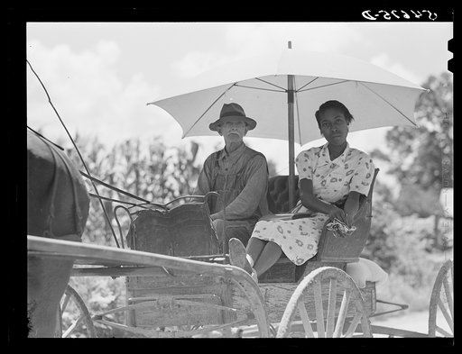Melrose, Natchitoches Parish, Louisiana. Mulatto and his daughter going to town for groceries and supplies in cotton plantation area