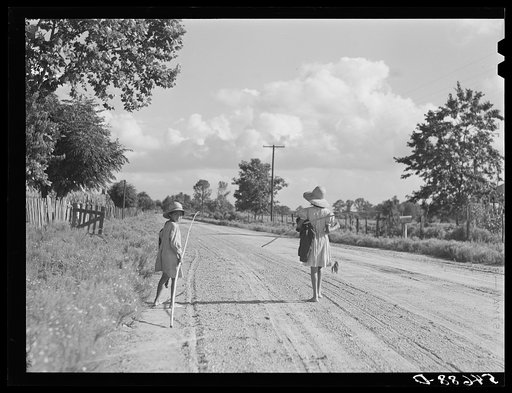 Untitled photo, possibly related to: Melrose, Natchitoches Parish, Louisiana. Children of mulatto family returning home after an afternoon fishing in Cane River