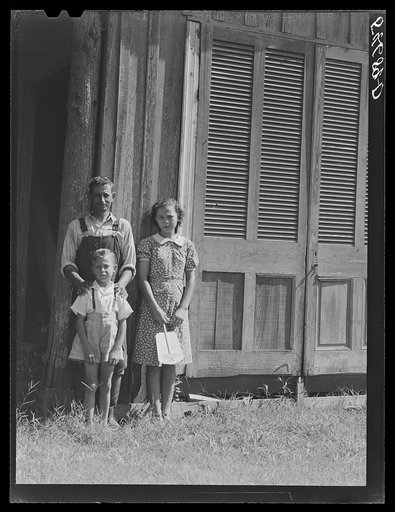 Melrose, Natchitoches, Louisiana. Mulatto servant with two of his children in front of home originally built by mulattoes. John Henry cotton plantation