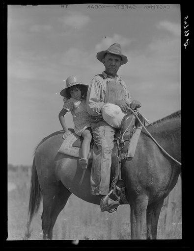 Melrose, Natchitoches Parish, Louisiana. Mulatto returning home after buying supplies at country store