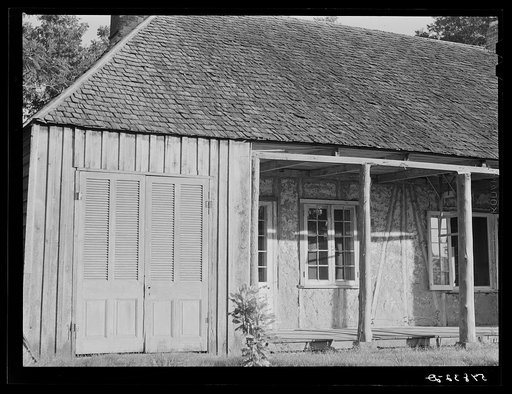 Melrose, Natchitoches Parish, Louisiana. Old home with mud walls built by mulattoes now a part of the John Henry cotton plantation. It was originally the house built on the Yucca Plantation by Augustin Metoyier in 1824 and later after the big house was built it was used as a slave hospital. It was s