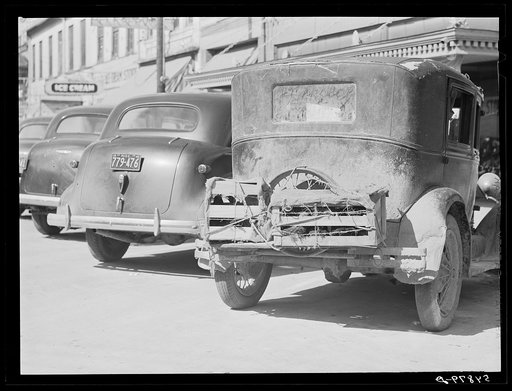 Crates of chickens on back of farmer's car. Port Gibson, Mississippi