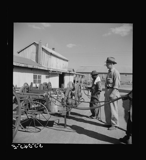 Untitled photo, possibly related to: On the King and Anderson cotton plantation near Clarksdale. Mississippi Delta, Mississippi. All the wagons are built and painted and most of the repair work done in their own shops