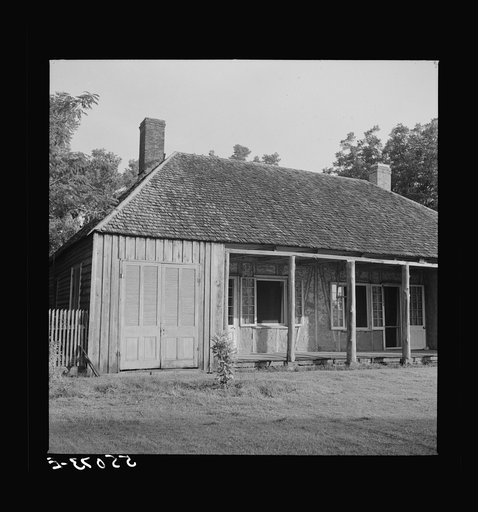 Untitled photo, possibly related to: Melrose, Natchitoches Parish, Louisiana. Old home with mud walls built by mulattoes, now a part of the John Henry cotton plantation. It was built in 1824 by Augustin Metoyier and sold to J.H. Henry in 1833. Originally it was the Yucca Plantation and later, after 