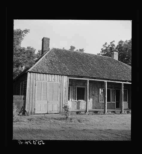 Untitled photo, possibly related to: Melrose, Natchitoches Parish, Louisiana. Old home with mud walls built by mulattoes, now a part of the John Henry cotton plantation. It was built in 1824 by Augustin Metoyier and sold to J.H. Henry in 1833. Originally it was the Yucca Plantation and later, after 